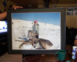 Douglas showing me a picture of his son Gavin who killed a caribou with a single shot from a .22 rifle. "Show this to Donald Trump," he said. Old Crow, YT