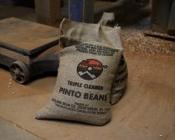 A pair of 20# bean bags is set aside at the Midland Bean Company warehouse in Dove Creek, CO.